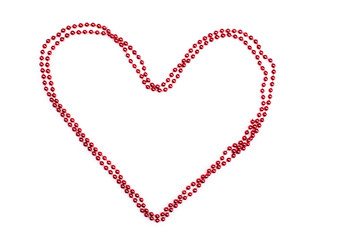 Contour heart of red beads on a white background