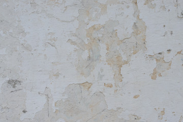 Wall fragment with scratches and cracks