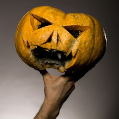 male hand with pumpkin