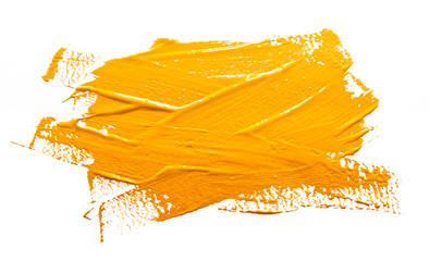 Yellow ochre strokes of the paint brush isolated