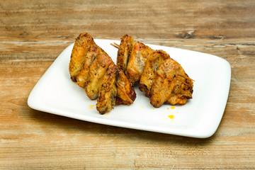 Plate of delicious barbecue chicken wings