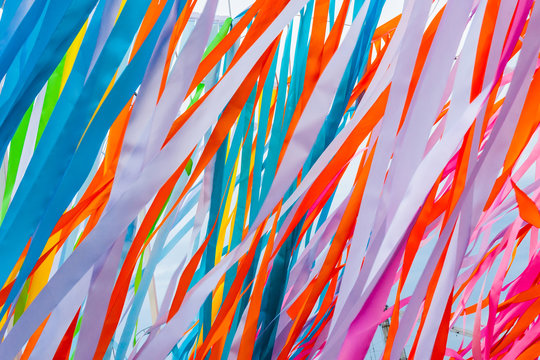 Colorful fabric ribbons wave in the wind