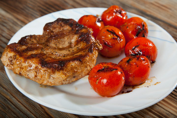 Delicious beef steaks on wooden table