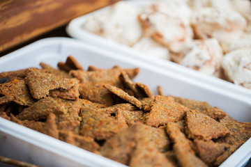 close up of cookies or cracker on serving tray