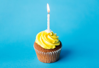 birthday cupcake with one burning candle