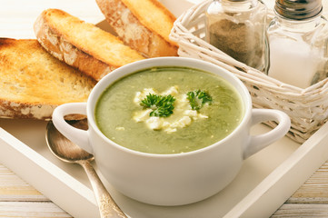 Vegetarian cuisine - spinach cream-soup with feta cheese.