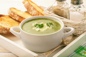 Vegetarian cuisine - spinach cream-soup with feta cheese.