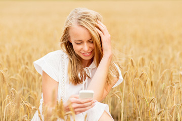 happy woman with smartphone and earphones