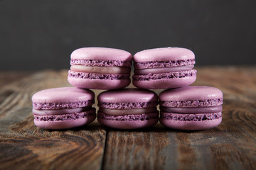 Still life with tea and delicious sweet blueberry macarons