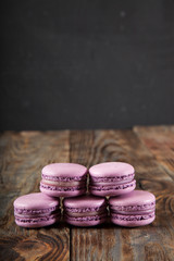 Still life with tea and delicious sweet blueberry macarons