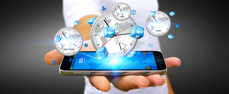 Businessman connecting time of the world with his mobile phone