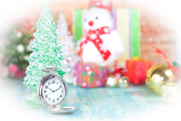 Fototapeta na wymiar pocket watch in snow ,christmas and new year concept