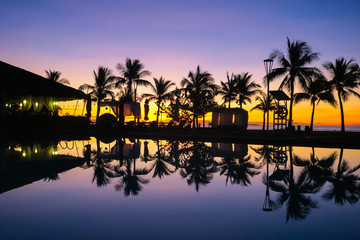Island Palm Tree Reflection by Resort Pool, Orange and Purple Beach Sunrise - Bohol, Philippines