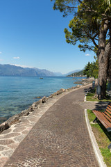  Garda lake with promenade in Torri del Benaco, Italy