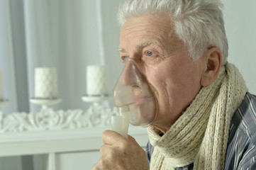 elderly man with flu inhalation