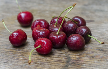 Ripe cherries on a wooden table