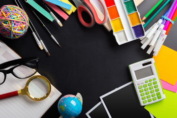 Desk of an artist with lots of stationery objects