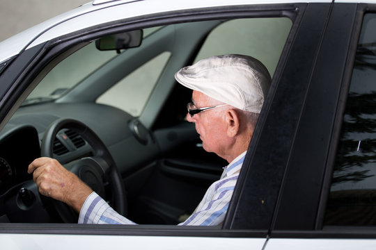 Senior Man Driving Car