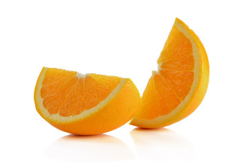 Sliced orange fruit segments isolated on white background