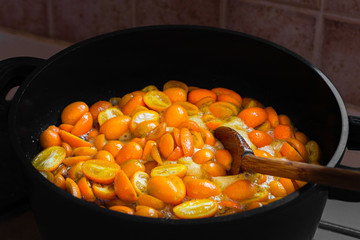 Cooking kumquat or orange homemade jam or marmalade