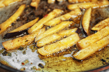 Eggplant on frying pan, closeup