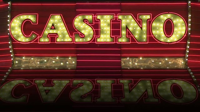 A looping vintage casino sign marquee with reflection and room for text.