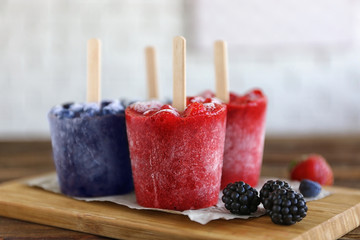 Tasty fruit ice-cream on cutting board