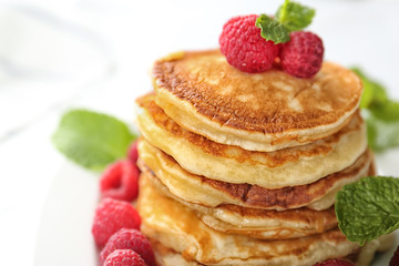 Tasty pancakes with berries and mint, closeup