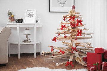 Creative Christmas tree in living room interior