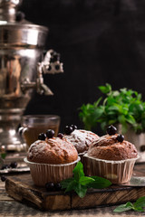 Blueberry muffins with powdered sugar and fresh berries