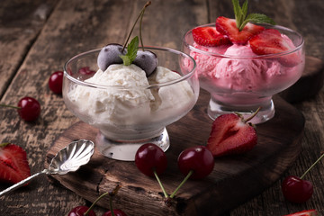 Delicious bowls of strawberry and vanilla ice cream with mint