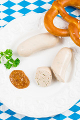 Bavarian sausage with pretzel, sweet mustard and beer