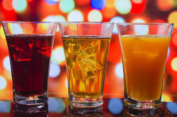 the refreshing juice with ice on a bright background