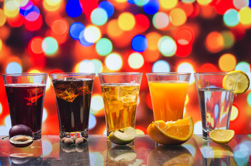 the refreshing juice with ice on a bright background