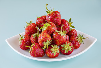 red strawberries on the plate