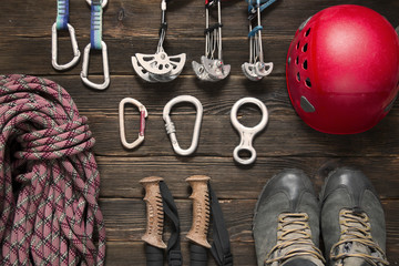 climbing and travel equipment on dark background