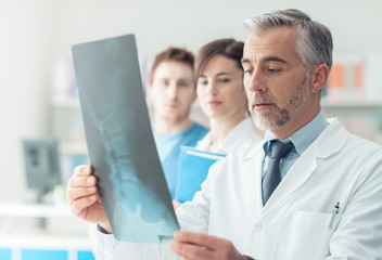 Medical team examining an x-ray