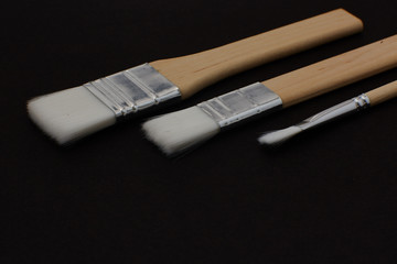 some type of brushes on black background