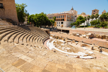 Sunny view of ancient amphitheater Teatro Romano de Malaga,  Malaga, Andalusia province, Spain.