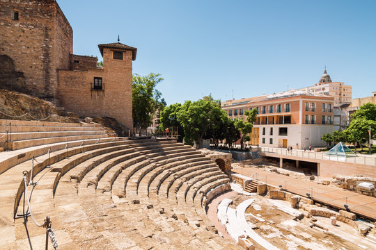 Sunny view of ancient amphitheater Teatro Romano de Malaga,  Malaga, Andalusia province, Spain.
