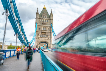 Fototapeta na wymiar Blurred traffic under Tower Bridge, London