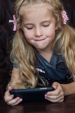cute little girl with a phone