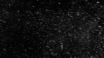 Falling real snowflakes from left to right, shot on black background, matte, wide angle, animation with start and end, isolated, perfect for digital composition