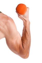 Dumbbell in a male hand on an isolated background