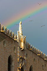 Fototapeta na wymiar Architectural section of San Marco with rainbow after rain in Venice