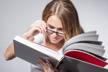 Young woman reading a book
