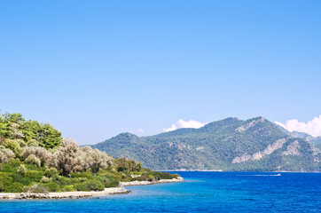 Fototapeta na wymiar The blue water of the Aegean Sea off the coast of the island