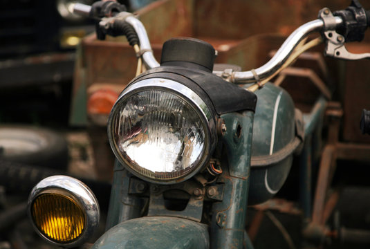 A fragment of a classic motorcycle with elements of chrome