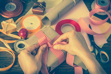 Christmas gift box, wrapping present with rustic paper and ribbon