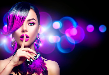 Sexy beauty fashion woman with purple dyed fringe hairstyle isolated on black background - obrazy, fototapety, plakaty